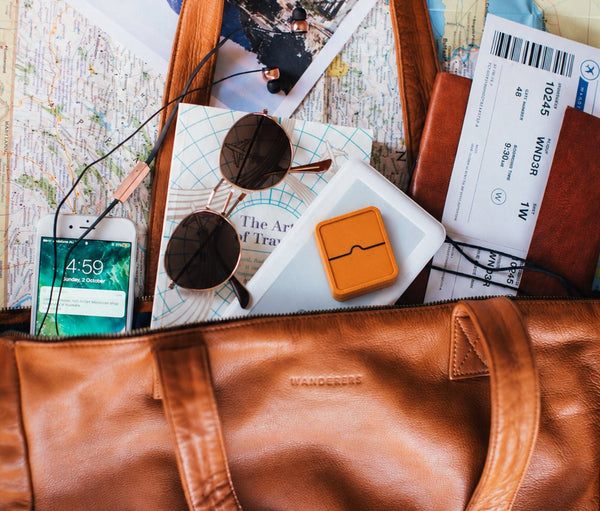 Earlywaker Waker packed in a travel bag with a boarding pass